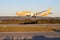 Scoot brand Dreamliner aircraft flying low before the hills landscape at Perth airport