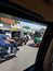 Scooter, autos carrying passengers and shops are seen in India