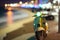 Scooter moped at ocean drive miami beach at night with neon lights from hotels. Neural network AI generated