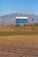 Scoreboard of baseball field dirt and mountains