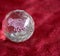 Scorpio and stars inside a transparent faceted abstract crystal on a bright red background