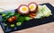 Scotch egg with pureed potatoes, carrots, tomatoes, greens