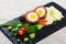 Scotch egg with pureed potatoes, carrots, tomatoes, greens