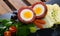 Scotch egg srved with mashed potatoes and greens, Scottish traditional dish