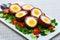 Scotch eggs with tomatoes, greens and leek, traditional Scottish cuisine