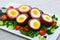 Scotch eggs with tomatoes, greens and leek, traditional Scottish cuisine