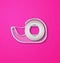 Scotch tape dispenser isolated on pink background