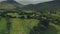 Scotland island landscape hyperlapse aerial view: yachts at ocean bay, village, whisky distillery