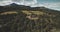 Scotland`s mountain, castle landscape aerial view: forests, valleys, hill. Ancient building in ocean