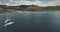 Scotland`s ocean coast sailboats aerial view in coastal water near Brodick village, Arran Island