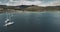 Scotland's ocean coast sailboats aerial view in coastal water near Brodick village, Arran Island