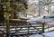 Scotland in winter: gate on snow-covered woodland track in Perthshire