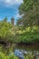 Scotlands Parks Ancient Ruins Lucious Greenery and a Gentle Flowing River with Reflections on the Water