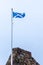 Scotlands Saltire Flag Flying High on Top of One of Scotlands Historic Castles in Seamill Scotland