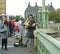 A Scottish Bagpipe Player on a Busy Westminster bridge in London