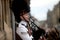 Scottish Bagpiper playing music with bagpipe at Edinburgh in Scotland 19 07 2019