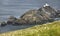 Scottish coastline landscape with lighthouse in Shetland islands