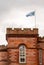 Scottish flag flying over a tower