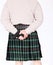 Scottish guy wearing a kilt with gun .