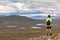 Scottish highland landscape: boy hiking in Glencoe mountain. Scotland, UK