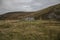 Scottish Highlands - dry meadows and stone barn.