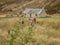 Scottish Highlands - dry meadows and stone barn on a gloomy day.