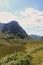 Scottish Highlands landscape in summer - road in the valley.