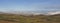 A Scottish Landscape of the Angus Glens looking towards Glen Esk, with snow on the tops of the Hills above the Farms.