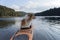 Scottish shepherd in a sit-in kayak in a mountain lake