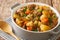 Scottish Stovies traditional Comfort Food with potatoes, meat and other vegetables close up in the pot. Horizontal