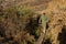 Scout or ranger crossing a log bridge