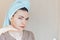Scowling girl in shock of her acne with a towel on her head. Woman skin care concept photos of ugly problem skin girl