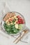 Scramble eggs with cherry tomatoes, fresh spinach leaves, avocado and crispbreads