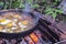 Scrambled eggs on a campfire camping in the nature Shakshouka national cuisine