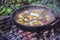 Scrambled eggs on a campfire camping in the nature Shakshouka national cuisine