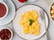 Scrambled eggs, Omelette. Breakfast with pan-fried eggs, cup of