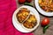 Scrambled eggs and refried beans tacos on wooden background. Mexican food