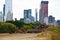 Scrap metal pile in center of Central Park, New York City, with dark clouds on sky pollution concept.