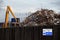 Scrap metal recycling compound viewed from boundary fence