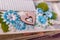 scrapbooking photo album page with paper decorative elements, flowers, hearts, beads. Leisure and hobby