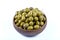 Scratched green olives. Turkish name; cizik yesil zeytin. Scratched green olives near olive branch on white background