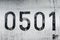 The scrawny old writing reads zero five hundred one written on the hull of the old plane