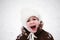 Scream child baby girl in snow outdoors in winter