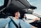 Screaming couple riding in car wide angle view