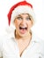 Screaming girl in Santa hat.