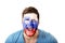 Screaming man with Slovenia flag on face.