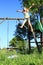 Screeming girl jumping from a slide