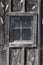 Screened mesh over window of an old building