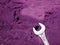 Screw tool displayed on purple blur backdrop