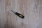 Screwdriver tool on blurred wooden background.